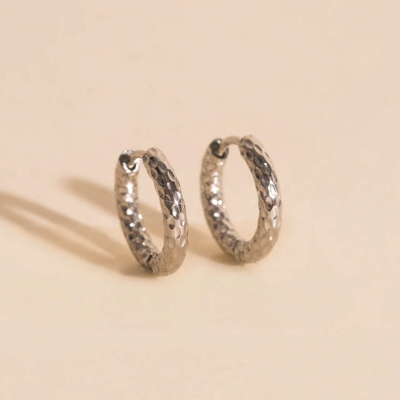 hammered chunky rounded hoop earrings | silver